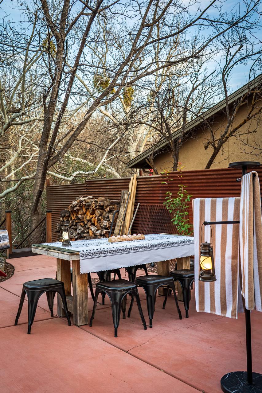 Creek deck with wine and red rock views